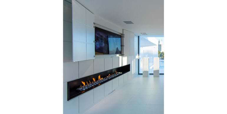 New villa in minimalist style with sea views in Moraira El Portet - Fireplace and TV-Cupboard - ID: 5500663 - Architect Carlos Gilardi (Equipo Digitalarq S.L.) - Photographer Michael van Oosten - Villa CAWOW