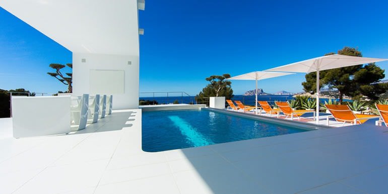 New villa in minimalist style with sea views in Moraira El Portet - Pool terrace and sea views - ID: 5500663 - Architect Carlos Gilardi (Equipo Digitalarq S.L.) - Photographer Michael van Oosten - Villa CAWOW