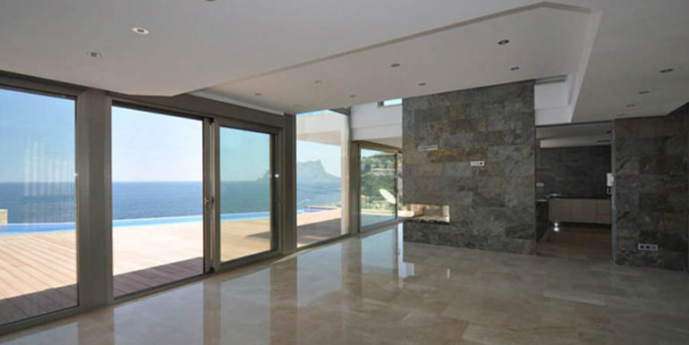 First line luxury villa in Benissa Cala Advocat - Livingroom with fireplace and sea views - ID: 5500674